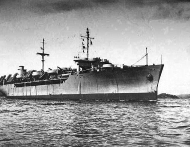 Black-and-white photo of cargo ship at sea