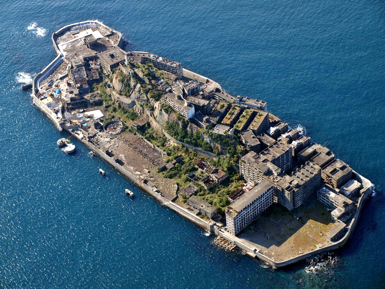 Aerial view of abandoned concrete island city in sea