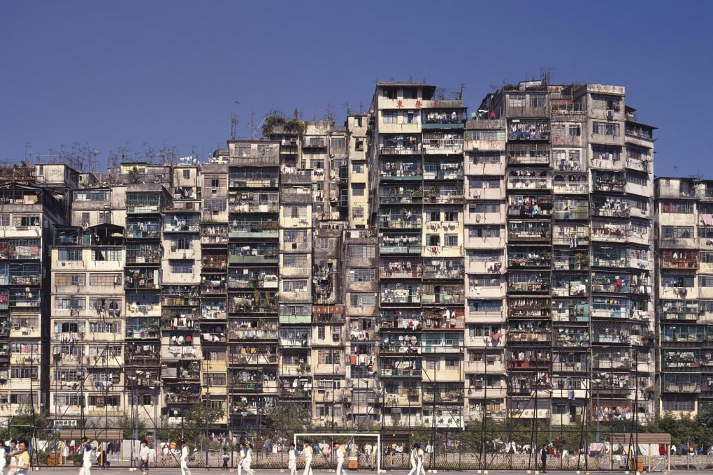 Crowded high-rise apartment facade with many small balconies