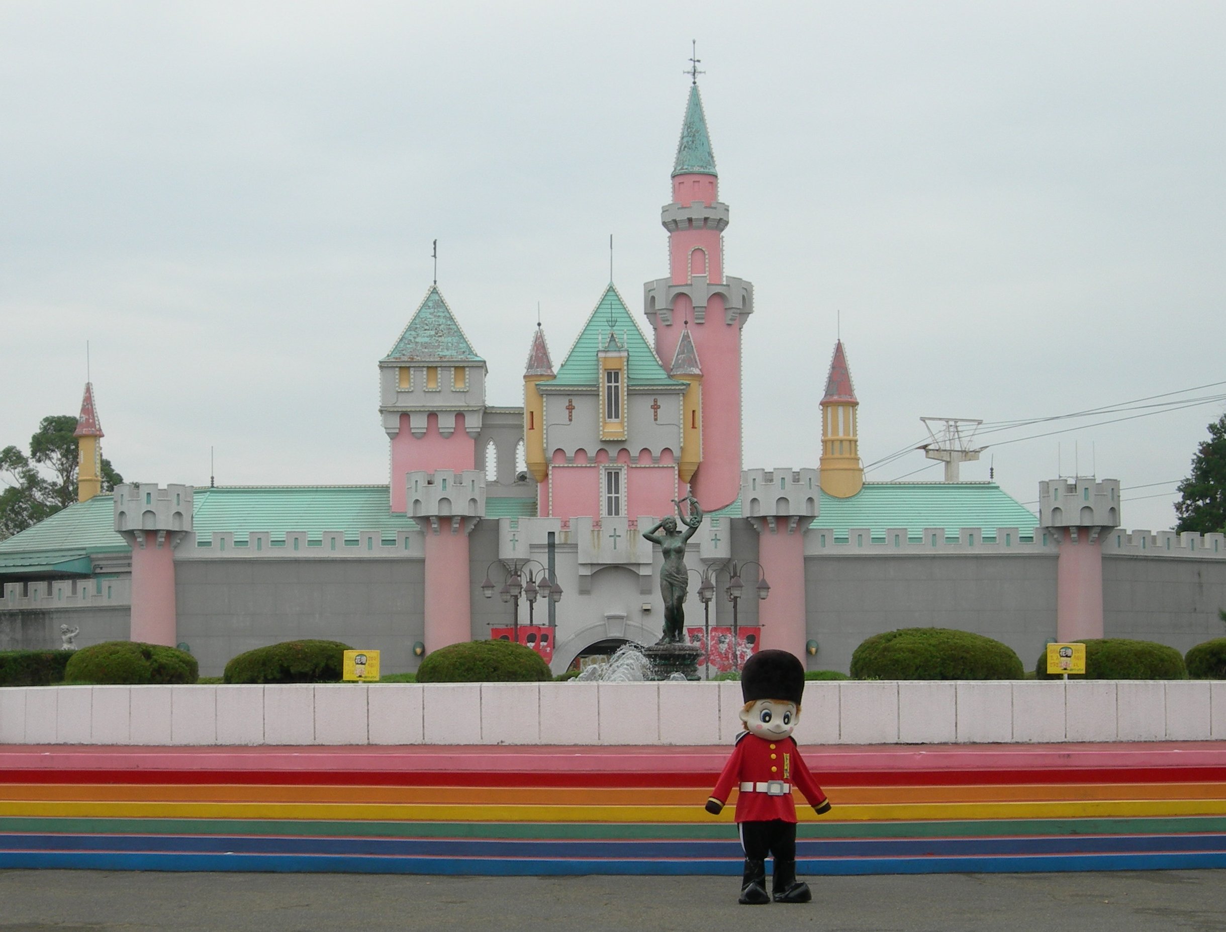 Cartoon guard stands before pastel fairytale castle