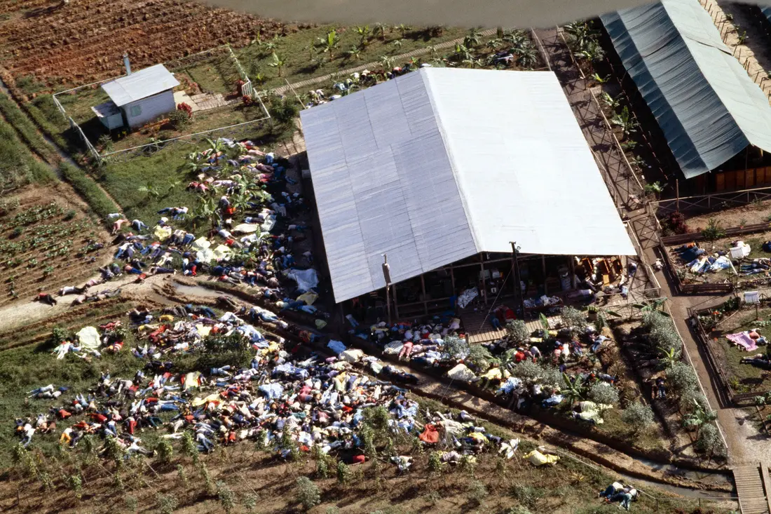 Aerial view of disaster scene surrounding large shelter