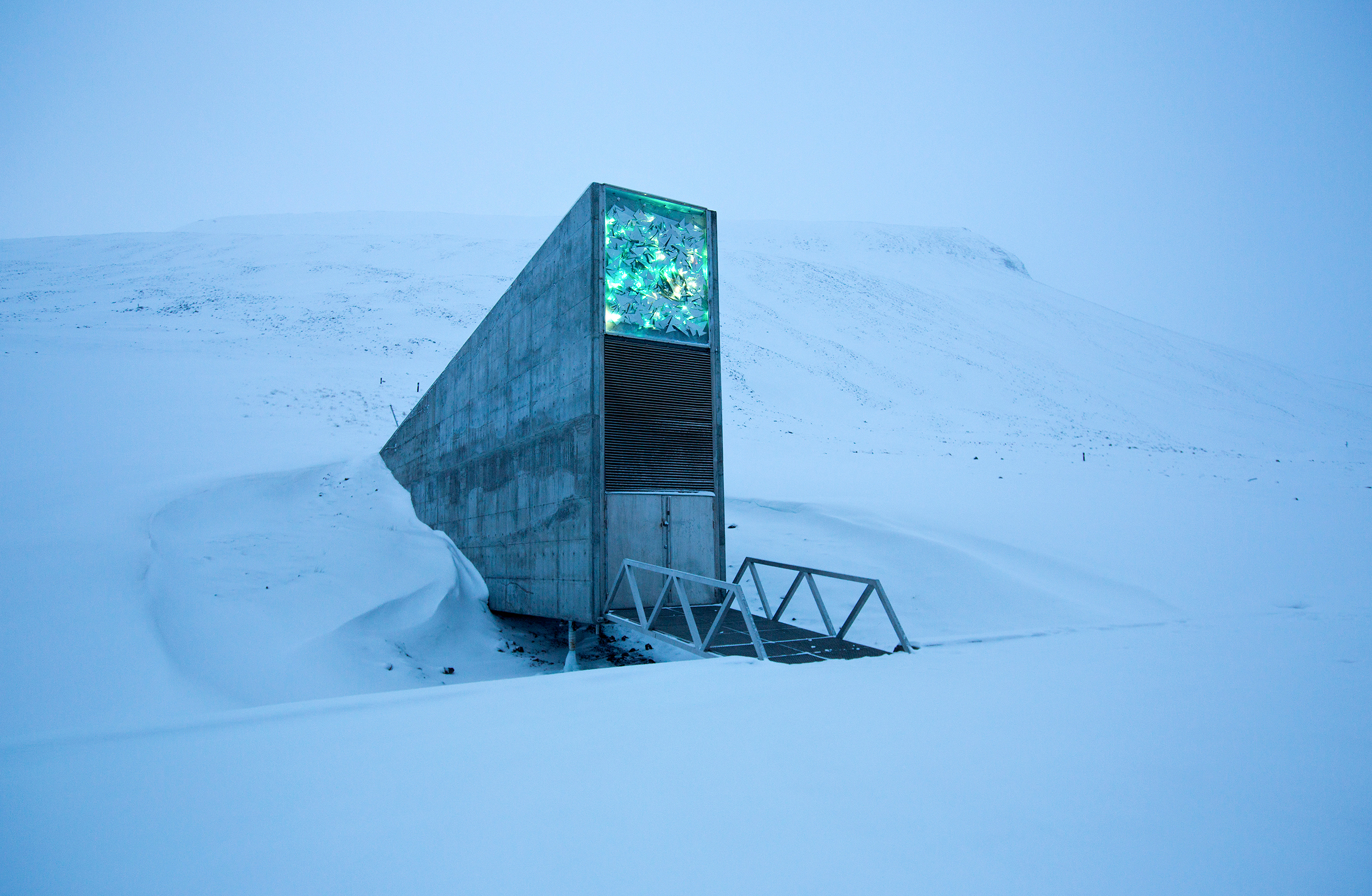 Arctic seed vault entrance glowing amid deep snow